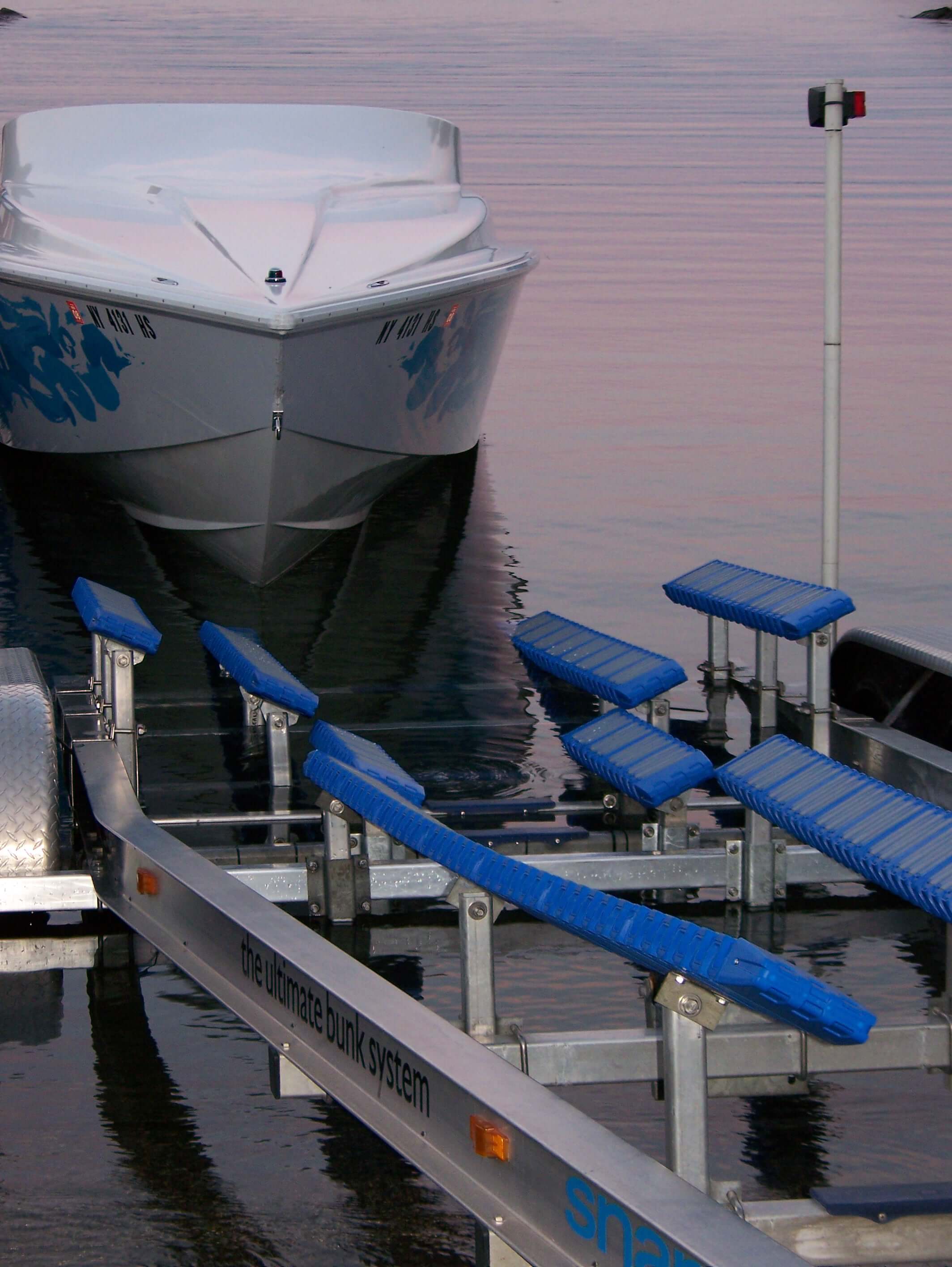 Image of boat trailer already fitted with Snaptraxx with a boat ready to be driven up onto it